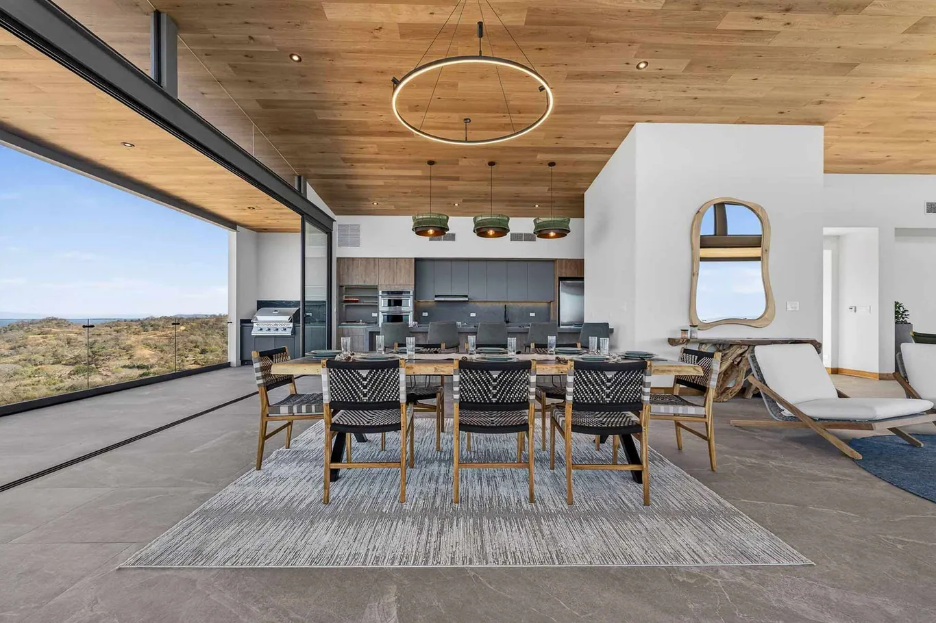 Wood-plank ceiling above a dining room open to the view